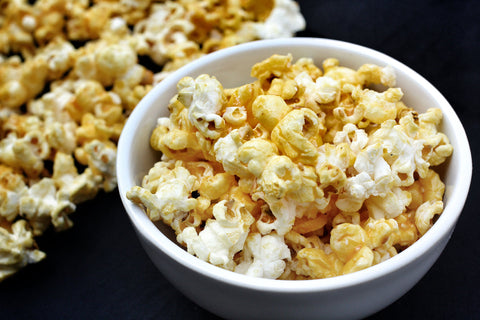 Popcorn with Grated Asiago, Cracked Black Pepper, and Mushroom Sage Olive Oil